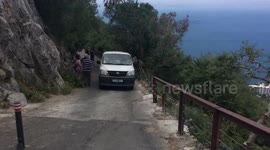Macaque Barbary Apes jumping on a tourist van in Gibraltar
