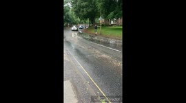 Man's not hot (getting splashed by cars)