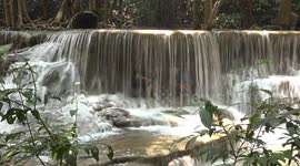 Hiding inside a beautiful waterfall in Thailand.