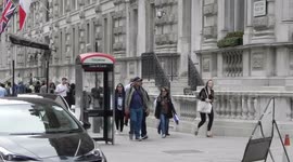 Staff and guests evacuate the Corinthia Hotel London after the fire alarm went off by Jim Connor