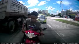 Hit-and-run Thai kids crash into back of car then ride away laughing