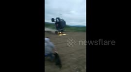 Watch an all-terrain vehicle ride vertically on its front wheels