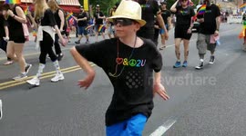 GLBT Pridefest Denver. Kid waiving hands abnormally