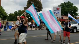 LGTB pridefest Denver Colorado on Colfax and Fillmore. A dad holding a sign saying I love my gay son