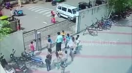 Terrifying moment heavy school gate collapses on children