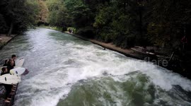 It's not easy surfing in a river