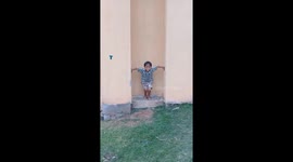 The boy climbed the wall like a spiderman