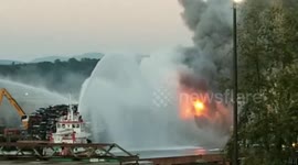 Massive plumes of smoke billow over huge barge fire in South Seattle