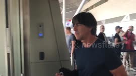 Löw and dejected German team board plane after Russia flop