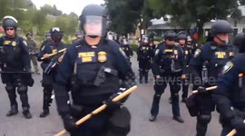 ICE protester in Portland films barricade of federal officers in riot gear
