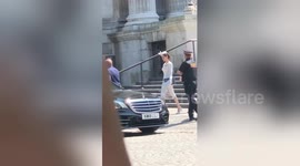 Angelina Jolie waves to fans after attending St Paul's Cathedral service