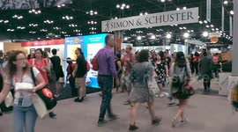 Crowds of people course through Exhibition Hall