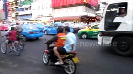 Serenading The Traffic In Bangkok.