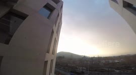 incredible drone flying past building