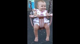 Trying her damnedest to swing herself !