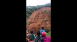 Landslide after storms in Vietnam wipes out two backhoe diggers