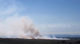 Firefighters tackle grass fire near Airdrie, Scotland