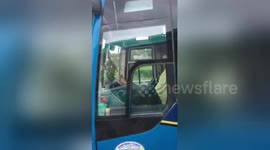 Reckless bus driver caught steering packed coach with his FEET