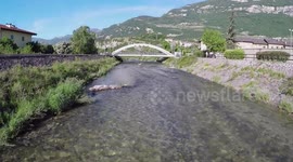 Crazy biker rides over bridge