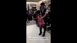Enthusiastic salesman is a hit with his pitch selling suitcase