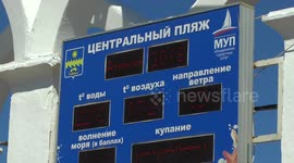 A lot of tourists at Anapa Central Beach Weak waves. Sunny day. Black sea.