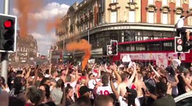 England fans light flares and jump on van in Clapham Junction after Sweden match