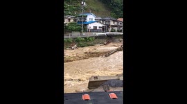 Road in Hiroshima 'caves in' after heavy rain