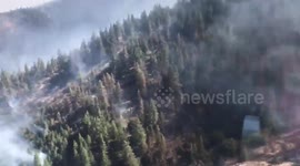 Ride inside an air tanker as it drops 3,000 gallons of retardant on fire