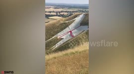 White Horse transformed into St George's Cross - but council workers remove red tape