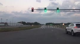 Driver sits in the middle of intersection