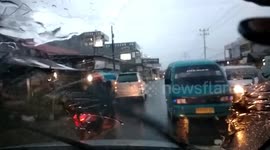 wrong way over taking city car in bad weather