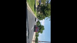 Lady going one way on a busy intersection in Denver