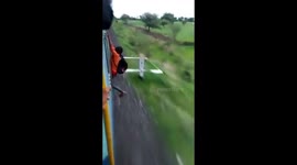 Indian man falls off speeding train as stunt goes wrong