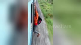 Indian man falls off speeding train when stunt goes wrong
