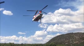 Chinook helicopter loading water for Colorado wildfire.  This is at Kodiak Lake near Basalt Colorado.