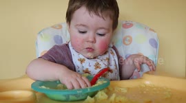 Messy little cute kid eating.
