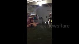 Come on in, the water's warm! Father shows off his 'private pool' as Typhoon Henry hits the Philippines