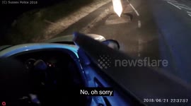 A woman was caught on police camera slurring her words while driving four times over the alcohol limit - with her son in the car