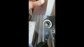 Man sticks his hand in moving fan