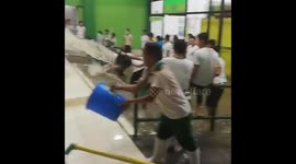 Scores of shop workers scoop out water with buckets in Philippines floods