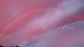 Filmer captures rare red rainbow over the sky in Arizona