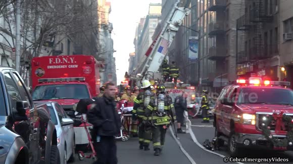 Building fire - FDNY firefighters in action tackling a 3rd alarm