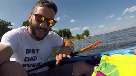 Hilarious moment man rescues bumblebee from drowning in lake