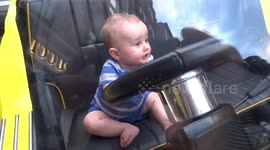 Baby at the wheel of Short and Sweet yellow car at Sloane Street Supercar Sunday in July 2018