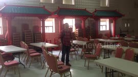 Guy falls sliding on the table