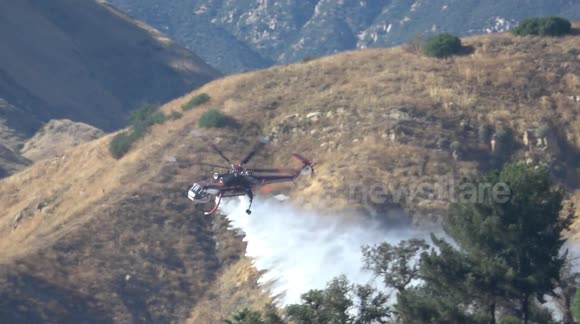 Wildfire: Fire helicopter does a water drop