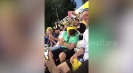 Funny moment cricket fans stack drinks on a sleeping fan