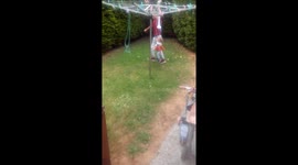 Dad makes merrigoround for toddler.