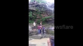 Shocking moment man plunges off 50-foot waterfall after trying to take selfie
