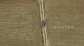 a shot from the air broken car on a rural road